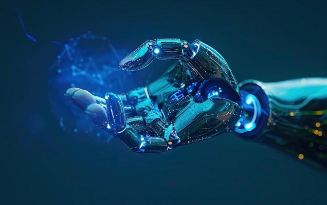 Realistyczna, futurystyczna grafika przedstawiająca metaliczną, cybernetyczną dłoń robota wyciągniętą do przodu na ciemnoniebieskim tle. Dłoń jest zbudowana z błyszczących elementów mechanicznych i obwodów, z niebieskimi, świecącymi diodami w stawach i na powierzchni palców. W jej wnętrzu unosi się półprzezroczysta, świetlista kula z siecią połączonych linii i punktów, przypominająca hologram lub wizualizację danych. Całość symbolizuje zaawansowaną technologię, sztuczną inteligencję i interakcję człowieka z maszyną.